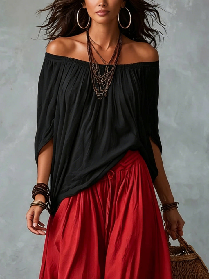 Top Negro Off-Shoulder y Pantalones Lantern Rojos de Corte Suelto